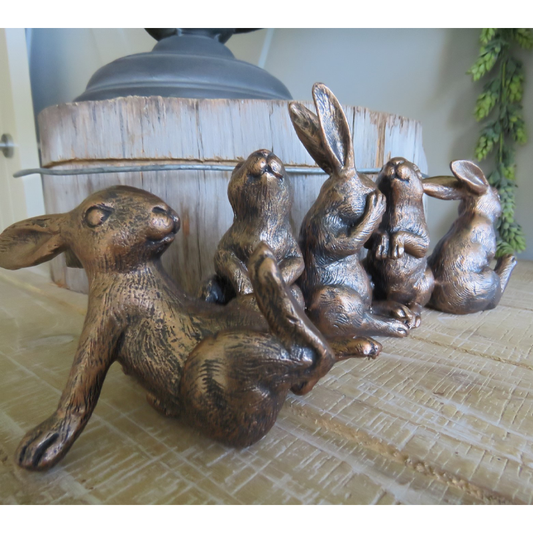 Side view of Bunny Capers weighted resin bunny figurine